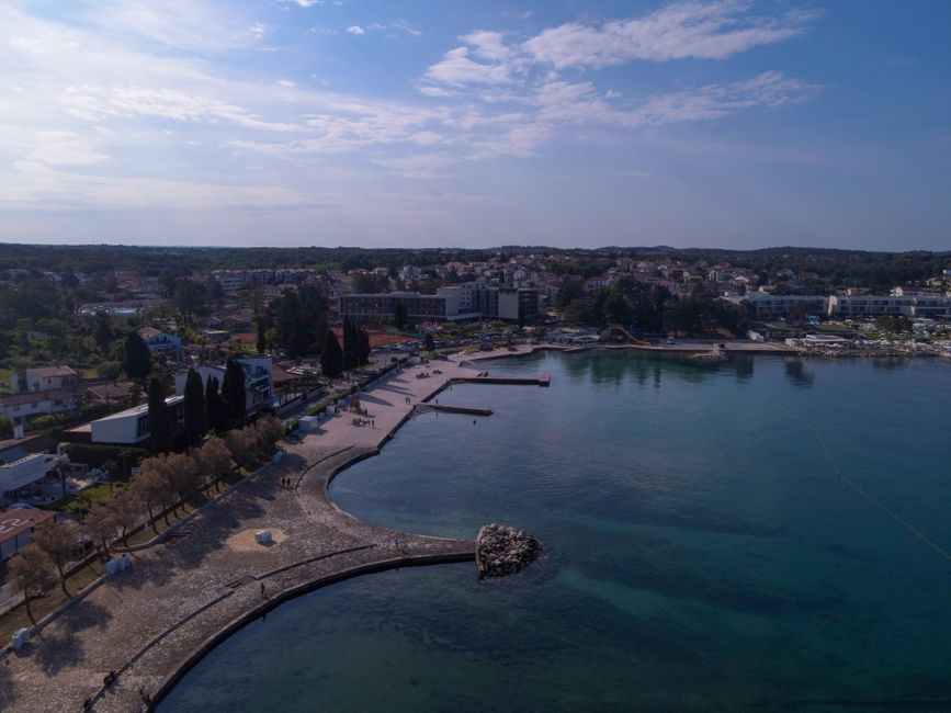 Aerial view of Poreč's picturesque coastline in Croatia during a summer day.