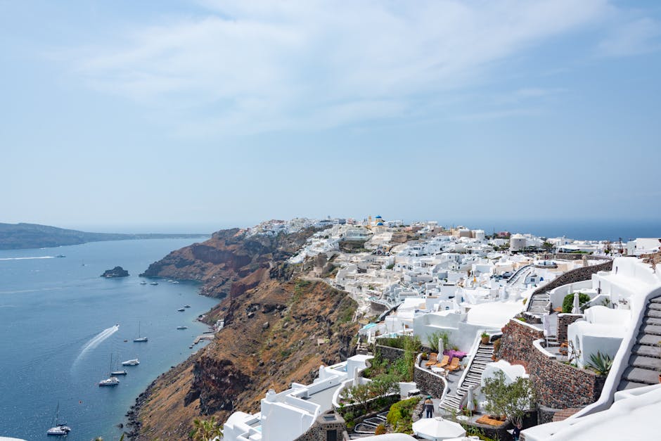 Picturesque view of Santorini's white architecture along the blue Aegean Sea.