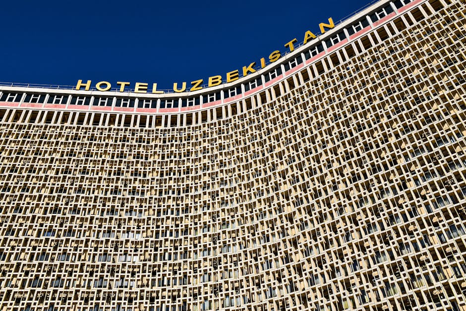 Detailed facade view of the Hotel Uzbekistan landmark in Tashkent, showcasing unique architecture.