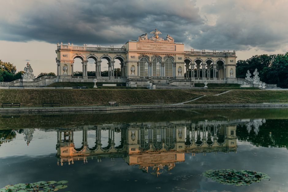 Majestic reflection of the Schonbrunn Palace Gloriette in Vienna, Austria with stunning architecture.